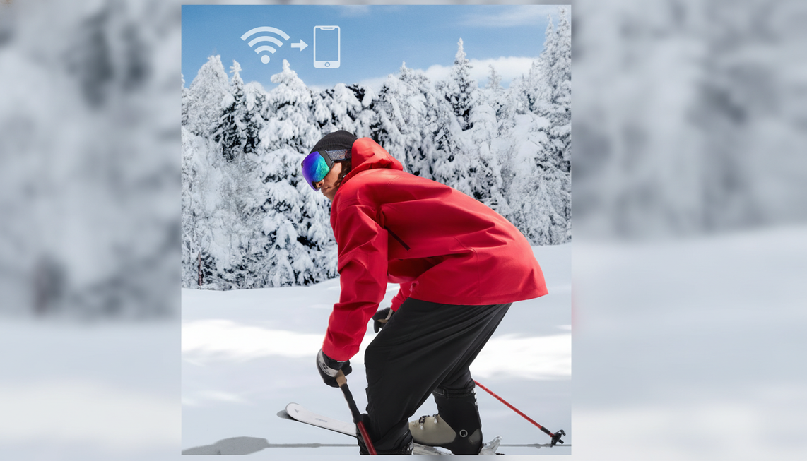 Ski goggles with a built-in camera on a snowy mountain slope, ready for wireless video transfer to a phone