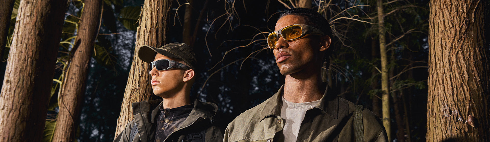 Two men walking through a forest wearing OhO Sunshine camera sunglasses